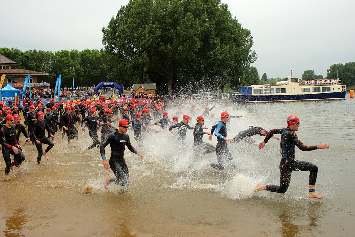 Triathletes enter the water at the Dambuster 2015