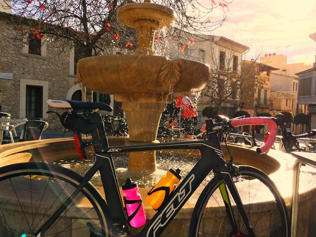 Are winter training holidays worth the money? - bike in Mallorca by a fountain