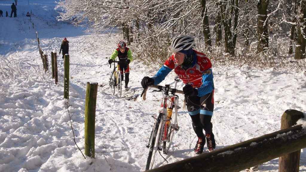Cycling in Cold Weather - cyclists in the snow 