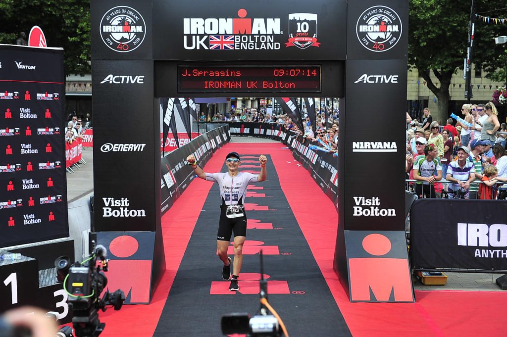 Joe crossing the Ironman UK finish line, successfully qualifying for Kona