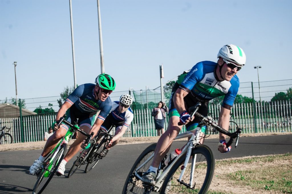 Get into crit racing - riders race around a corner