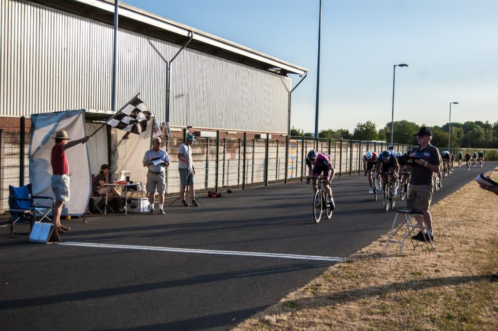 Get into crit racing - the riders approach the finish line
