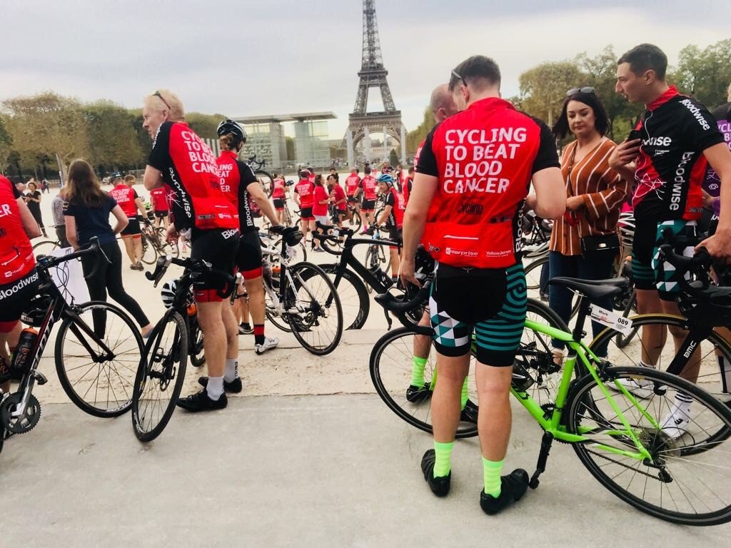 How tennis got me back on my bike - Cyclists at the Eiffel Tower after completing London to Paris with Bloodwise