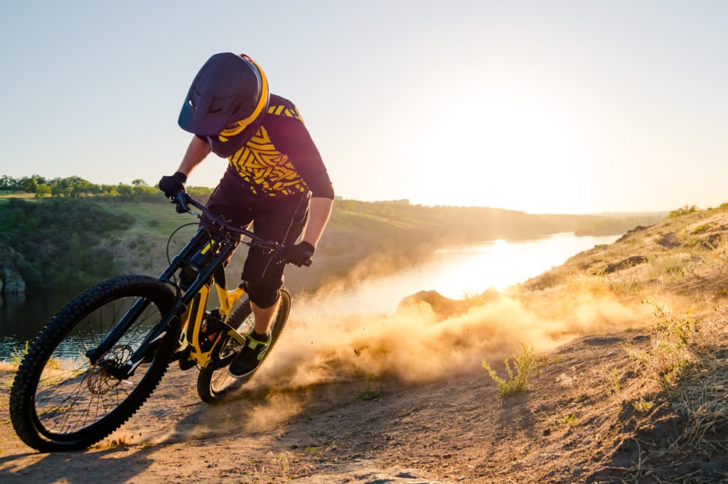 cyclist carves the trail, evening, enduro 