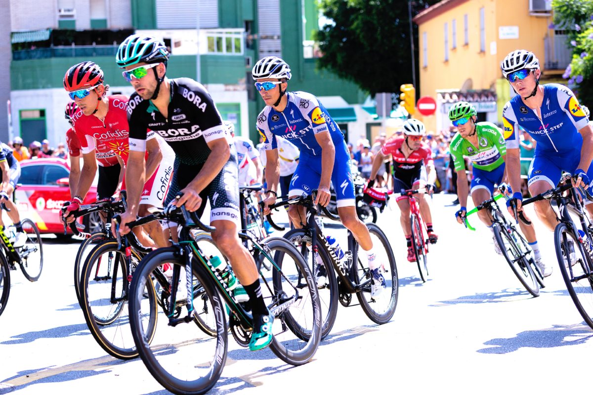 pro cyclists in the 2018 tour de france riding past the feed stop quick step use ketones