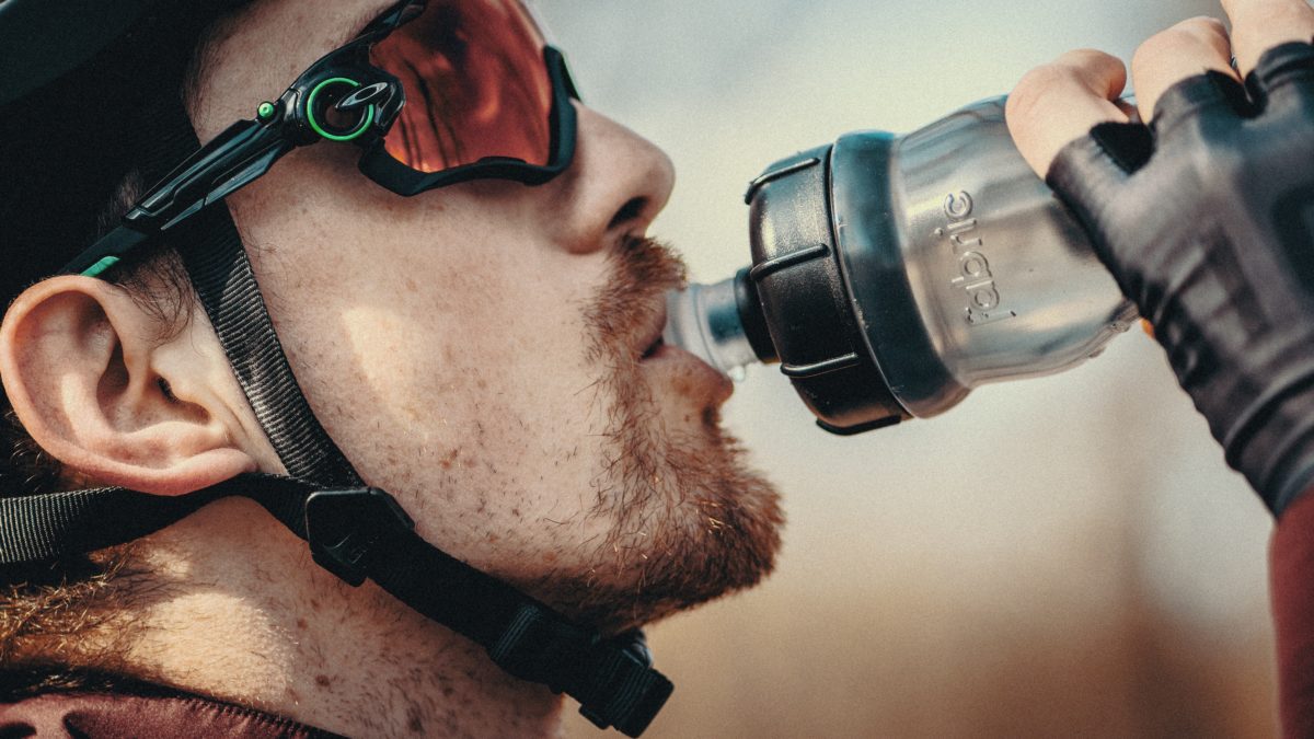 cyclist drinking energy drink - Cycling hydration