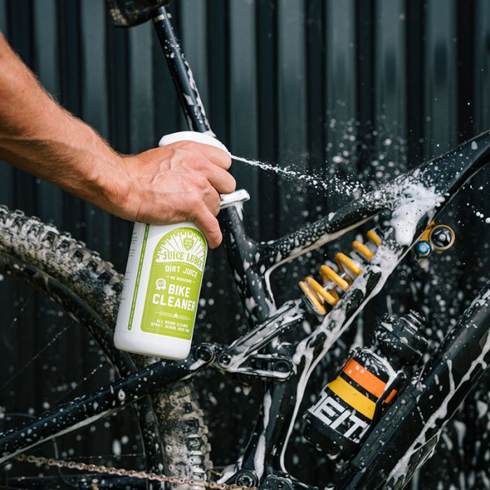 bike cleaner being sprayed onto a mountain bike