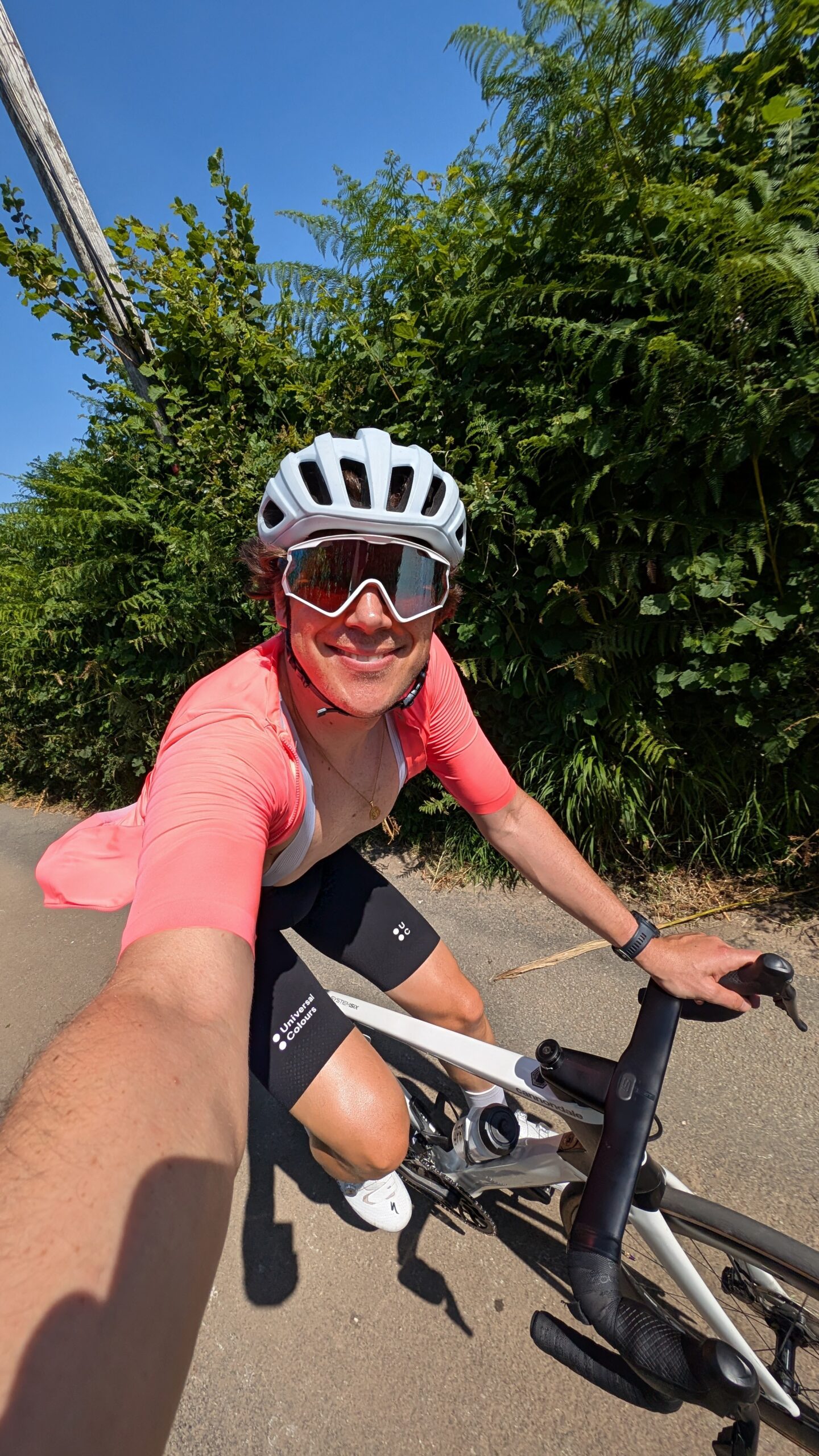 a cyclist riding in the sun